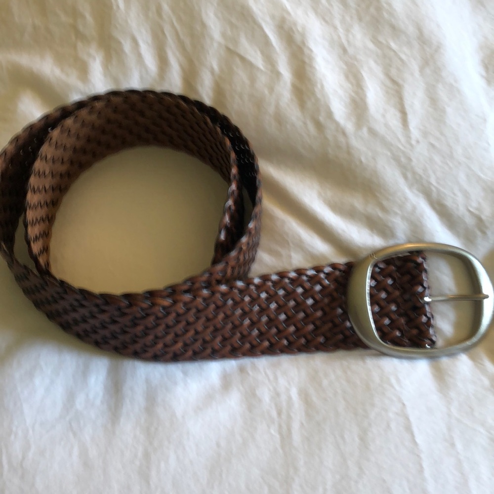Woven brown leather belt with nickel buckle.